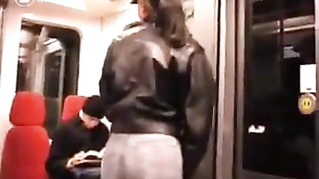 Woman in leather jacket wets gray jeans on subway, man watches