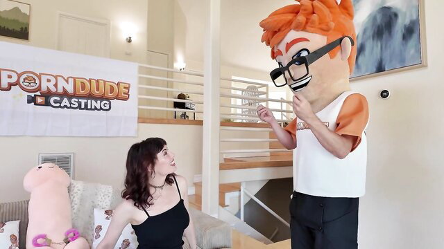 Olive Glass with Porn Dude mascot in casting couch setup