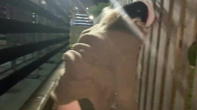 Blonde bending over inserting large raw chicken into pussy at night