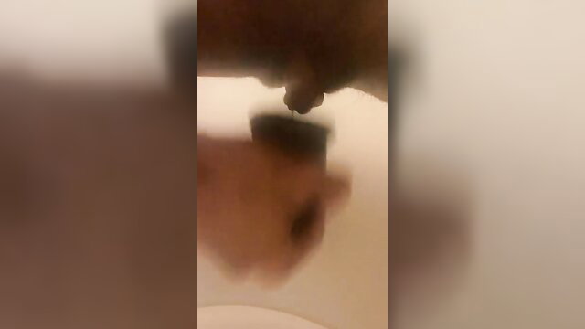 HotnHornyFtm stroking juicy T-dick with FTM stroker toy closeup