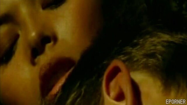 Closeup of aroused Asian woman with parted lips in retro porn