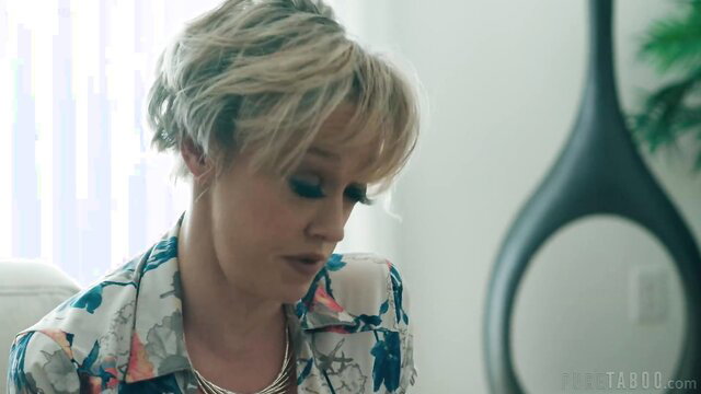 Dee Williams blonde MILF in floral blouse closeup gaze