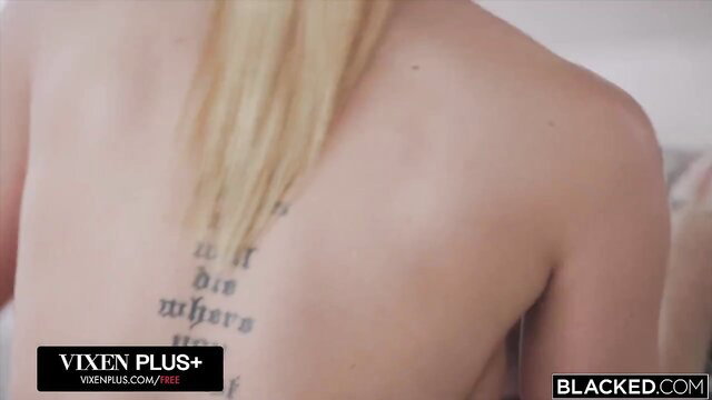 Blonde model shows back tattoo in Blacked interracial scene