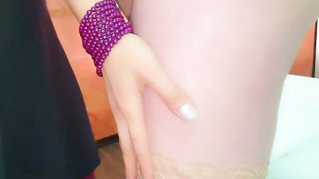 Asian woman hand on nude leg in stockings, teasing threesome foursome invite