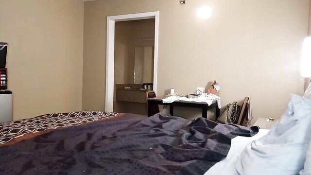 Hotel room bed with rumpled sheets before black MILFs shower orgy