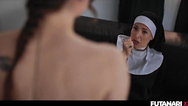 Tattooed brunette facing busty Asian nun in provocative fetish stare-down