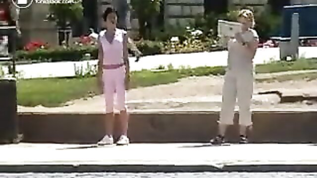 Outdoor public pants mess: Asian teen in pink capris, blonde in white with boombox