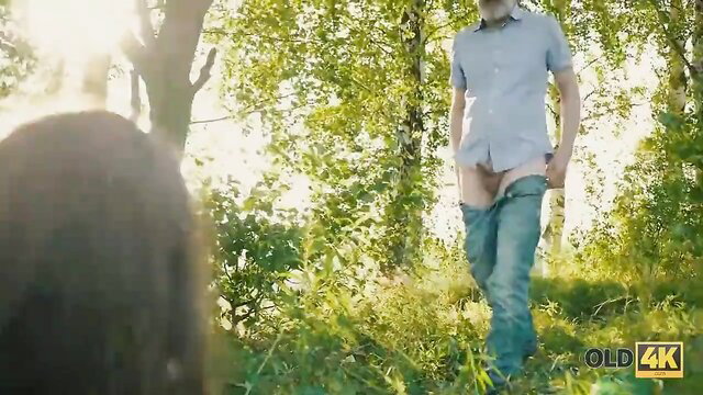 Teen babe watches old man expose cock in forest outdoors