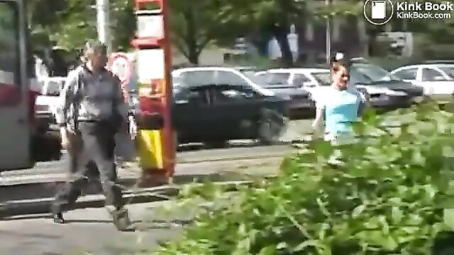 Outdoor public mess: woman in shorts, man approaches at gas station