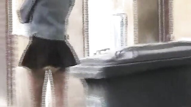 Dany in short skirt bending over trash can in public pantypoop scene