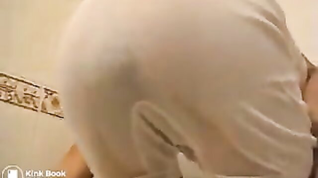 Dany in wet white shorts bending over in bathroom mess scene
