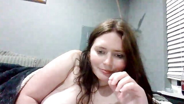 Luckygirl96 nude on bed, big tits exposed, seductive pose