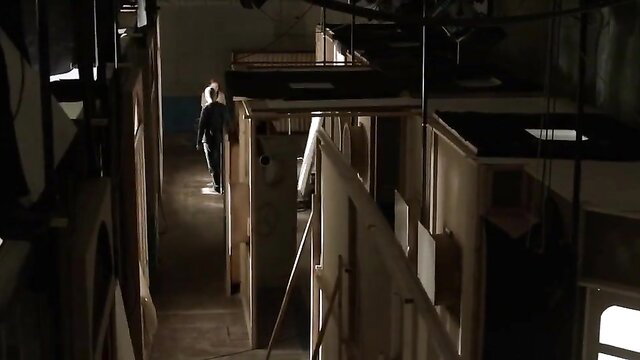 Natasa Janjic as Lidija in dark eerie hallway, You Carry Me 2015