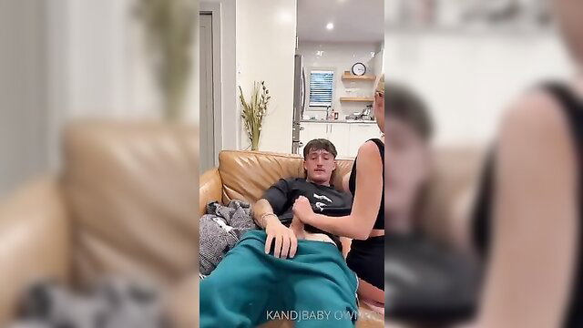Kerri Gribble gropes boyfriend's cock on couch in tight dress