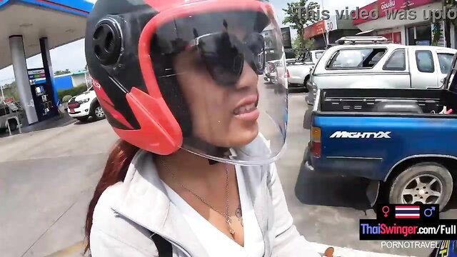 Hot Thai amateur teen in helmet shades at gas station
