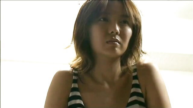 Japanese woman in striped tank top, serious expression, JAV thumbnail