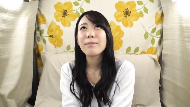 Beautiful Japanese wife smiling playfully in white top, amateur vibrator tease