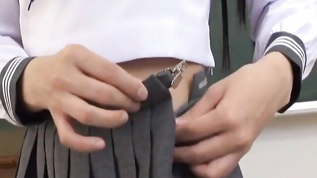 Japanese schoolgirl lifting pleated skirt, teasing upskirt view