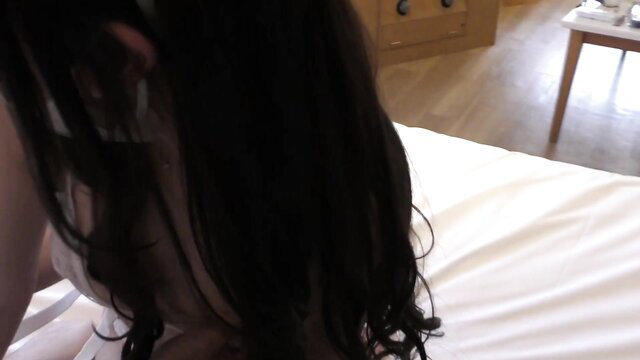 Asian amateur babe with long black hair lying nude on bed, side profile tease