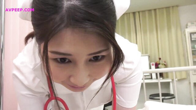 Asian nurse in tight uniform closeup face, seductive eyes and stethoscope