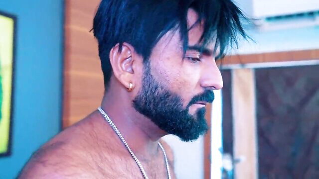 Handsome bearded Indian man shirtless side profile closeup