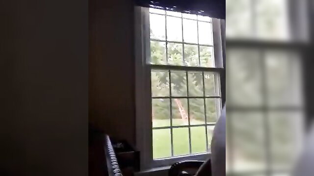 Man masturbating by window in living room solo amateur scene