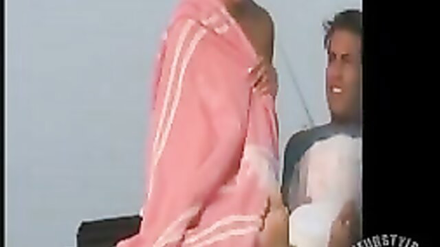 Black woman dropping pink towel nude with man, teasing exposure