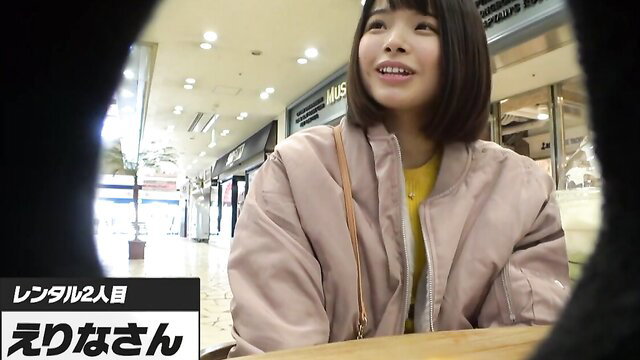 Cute Japanese bob haircut girl smiling in mall, comfy casual jacket