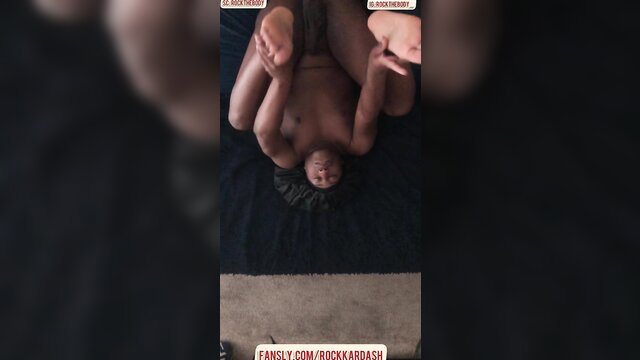 Nude woman in flexible upside-down pose exposing pussy and soles