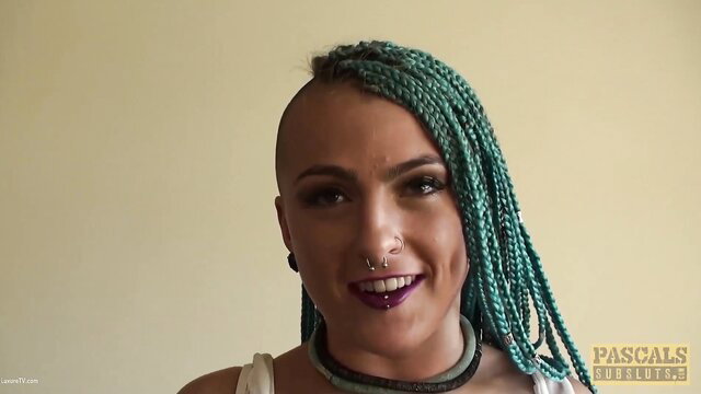 Orion Starr turquoise braids shaved head smiling in Pascals Subsluts