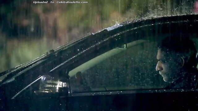 Ana de Armas and Lorenza Izzo in rainy car scene from Knock Knock