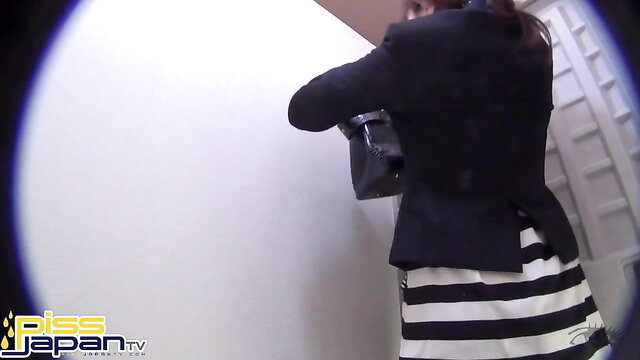 Asian woman in blazer and skirt rushing to pisser, Piss Japan TV