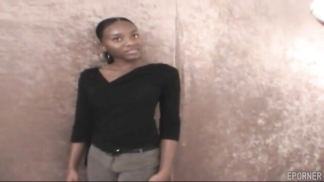 Candy Caprice ebony babe in black top and gray pants hot pose