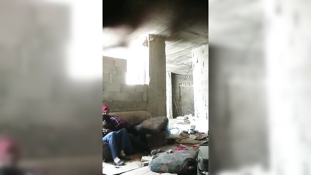 Turkish man in red cap sits casually on couch in amateur video thumbnail