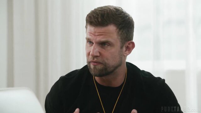 Muscular bearded man in threesome preview on sofa