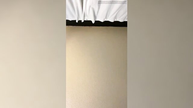 Sofie Halili topless solo in beige room with white curtains