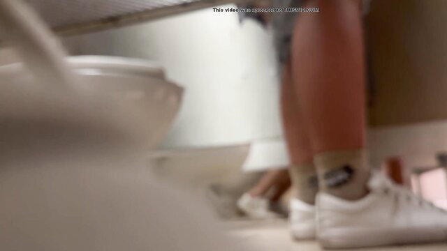 MILF legs peeing in mall toilet, voyeur upskirt view