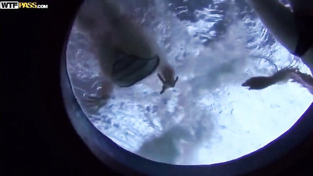 POV underwater view of woman flashing tits and grabbing dick in public pool