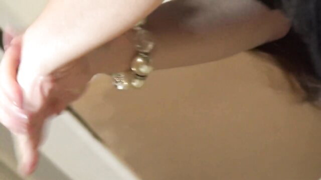 Tiffany Doll closeup arm and pearl bracelet in adult video thumbnail