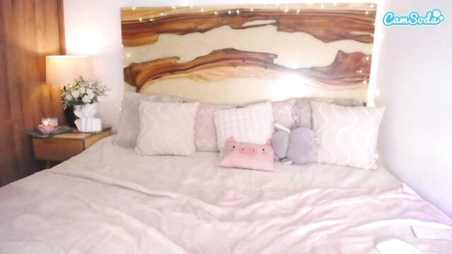 Latina beauty's cozy bedroom striptease in pink lingerie