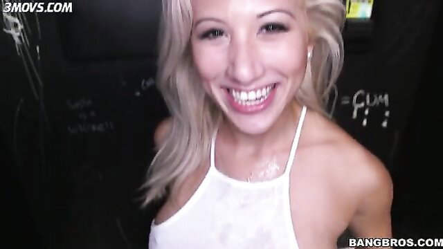 Cristi Ann smiling with cum on tits at glory hole BangBros