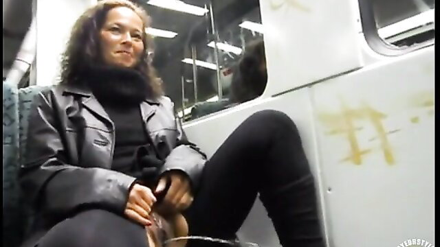 German beauty in leather jacket pees on train seat