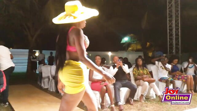 African model with huge booty struts in yellow bikini at fashion show