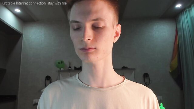 Shaved-head ginger twink masturbates solo on cam