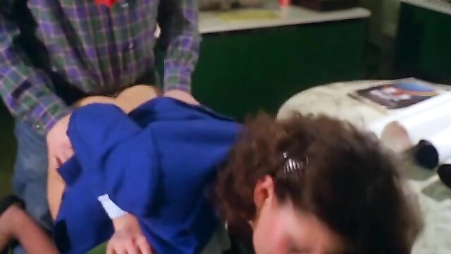 Vintage brunette bent over bed in blue dress, man groping ass from behind