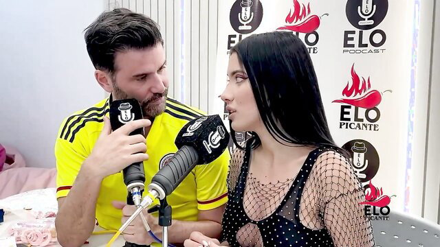 Ambar Prada in sexy fishnet top interviewed by EloPodcast host