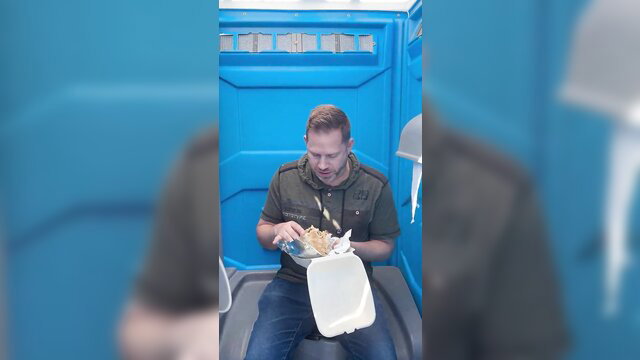 Man eating food in portable toilet, bizarre fetish thumbnail