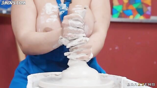 Nia Bleu topless with clay-covered big tits at pottery wheel