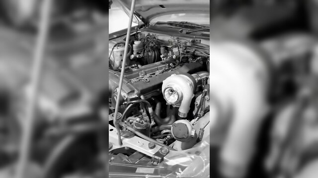 E30princess inspects turbo engine in low-cut top, hot car girl tease