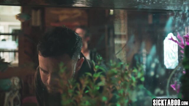 Ember Snow peeking from aquarium in wet top, big tits tease